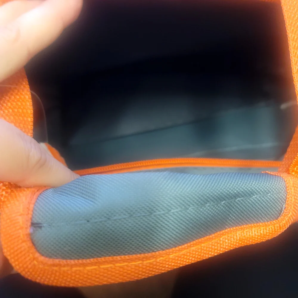Vibrant Green and Orange Travel Bags for Adventurers